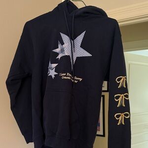 Black Hoodie with Star and Bow Design